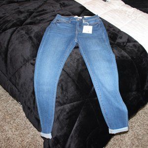 medium wash high rise uber skinny
